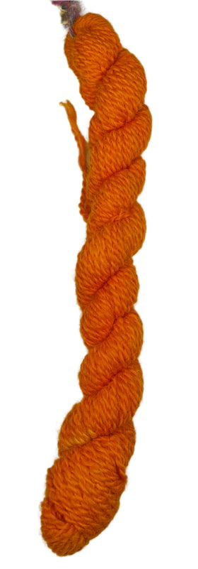 Saffron colored mini skein of yarn