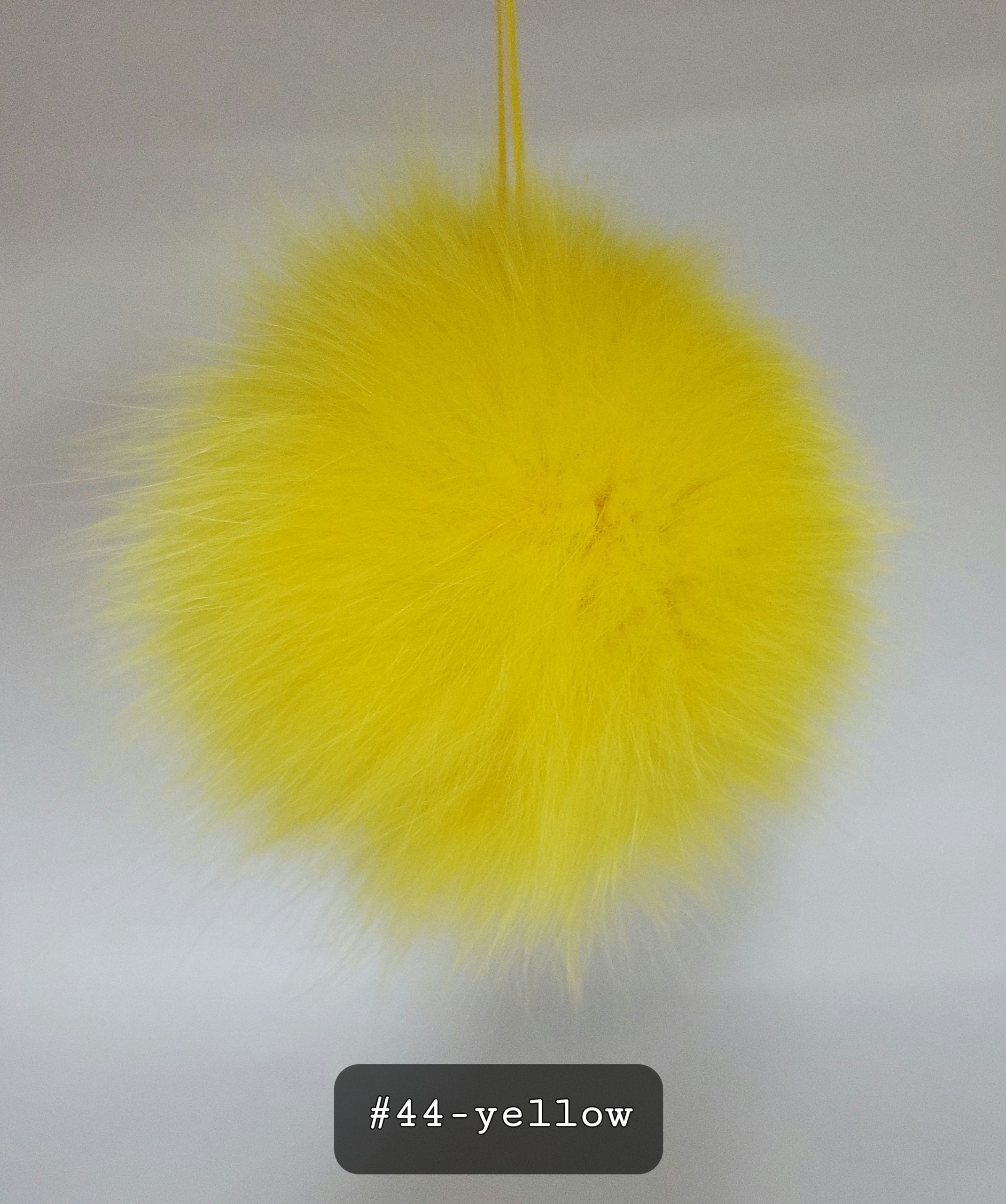 Fur Pompoms Small by Schildkraut color yellow
