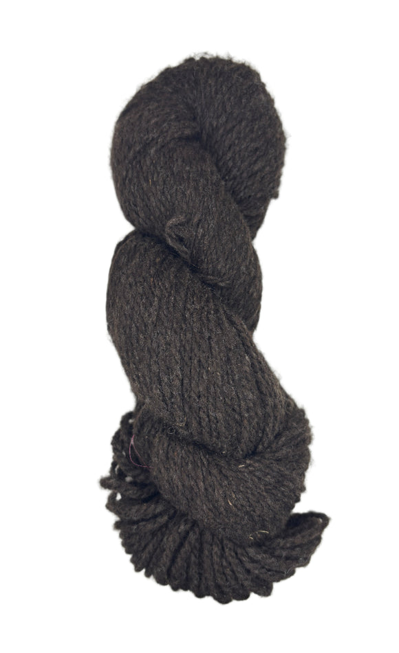 Dark brown skein of yarn on a white background