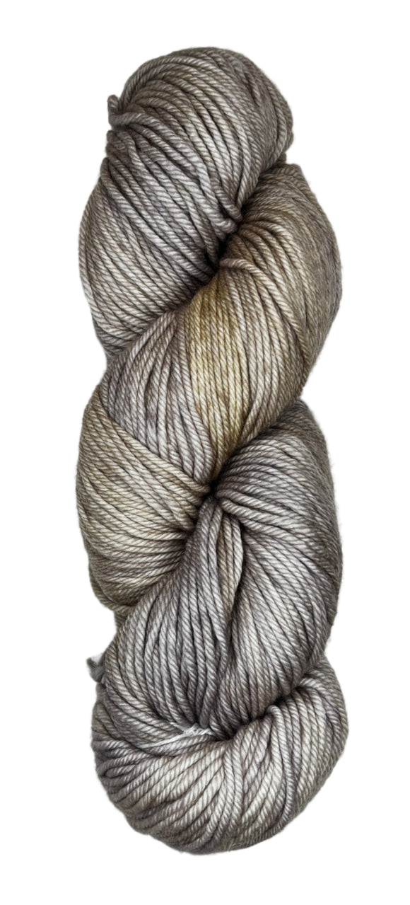 A skein of wool yarn in the color grey with khaki streaks