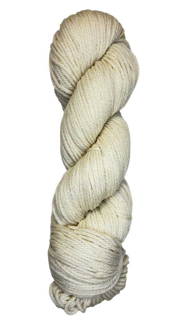 A skein of natural cream colored wool yarn