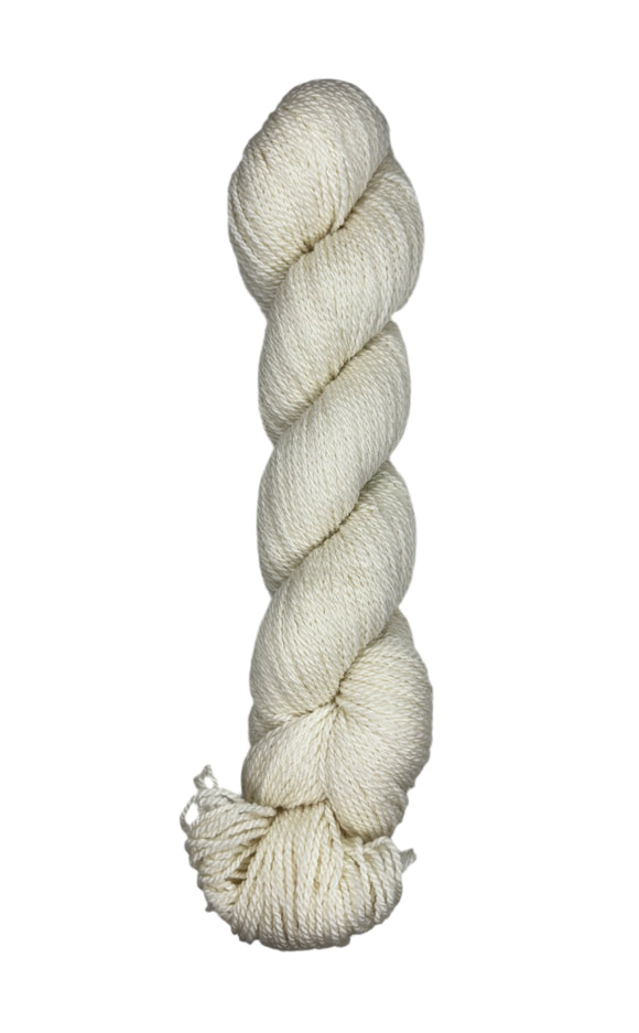 A skein of Mountain Meadow Wool Yarn in the color natural