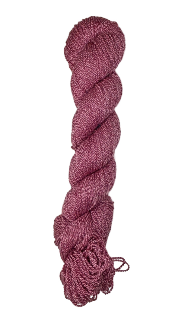A skein of yarn in a berry red color