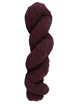 Wine colored skein of mountain meadow wool yarn on a white background
