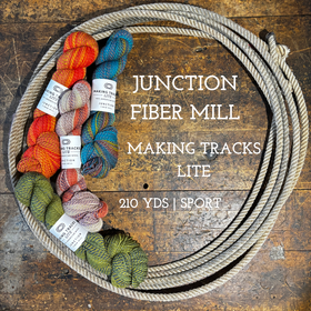 Skeins of variegated handspun looking yarn on a wooden surface