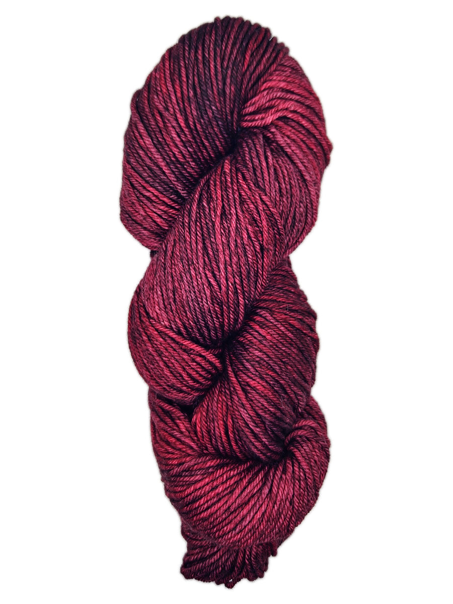 A hank of dark red yarn by Malabrigo Rios yarn
