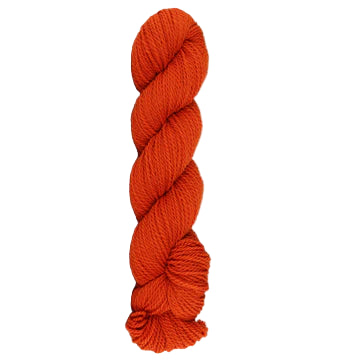 Orange skein of mountain meadow wool yarn on a white background