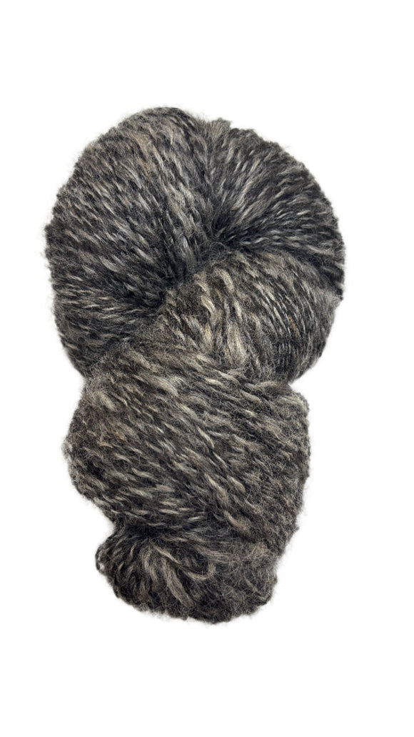 Gray and black skein of yarn on a white background