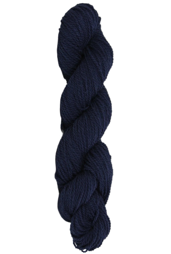 Dark Navy Blue skein of mountain meadow wool yarn on a white background