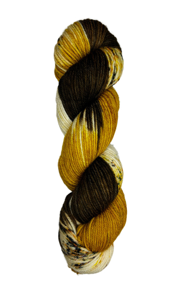 BROWN AND GOLD SKEIN OF WORSTED WEIGHT YARN
