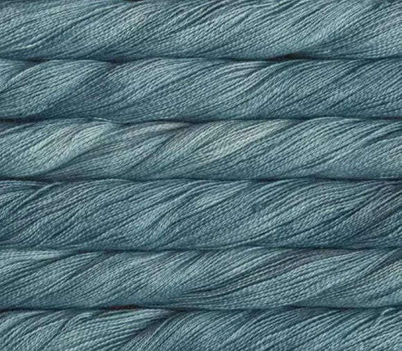 close up view of malabrigo silkpaca lace weight yarn color blue