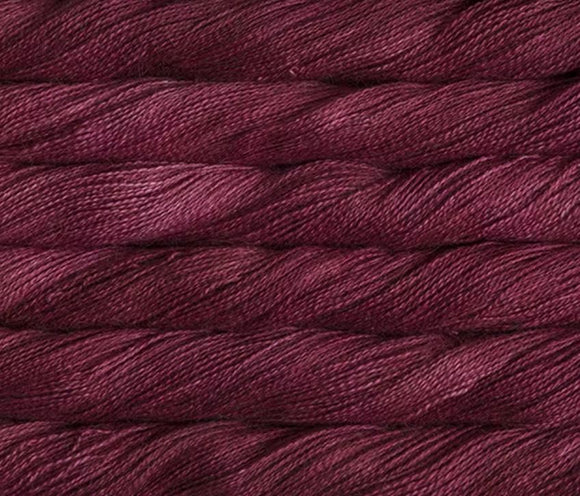 close up view of malabrigo silkpaca lace weight yarn color red