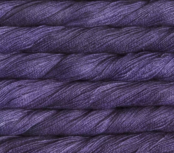 close up view of malabrigo silkpaca lace weight yarn color purple