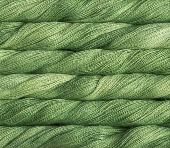 close up view of malabrigo silkpaca lace weight yarn color green