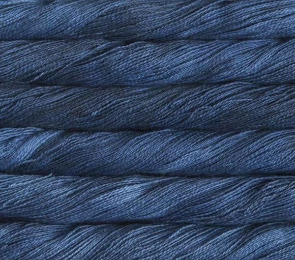 close up view of malabrigo silkpaca lace weight yarn color blue