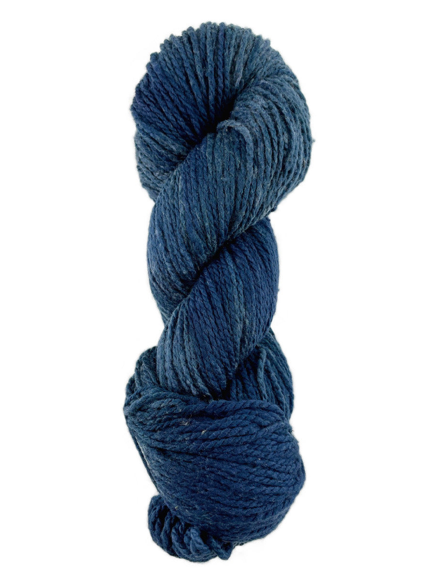 A blue skein of Mountain Meadow Wool Laramie yarn
