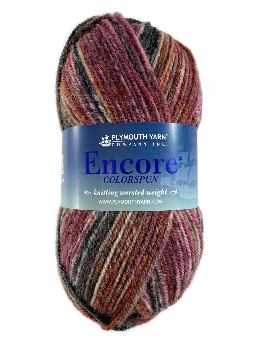 A red and black skein of Plymouth Encore Colorspun yarn