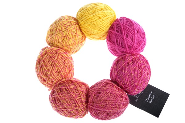 A yellow and pink set of Schoppel Zauber Perlen yarn balls