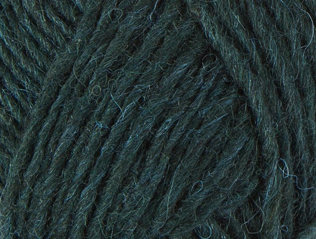 A close up photo of dark green Istex Lettlopi yarn