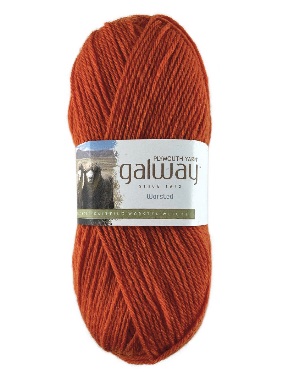 An orange skein of Plymouth Galway yarn