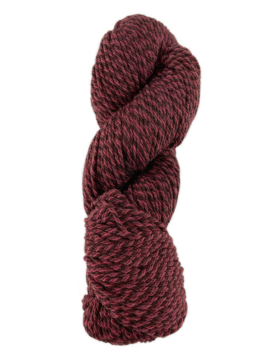 A red marled skein of Mountain Meadow Wool Cora yarn