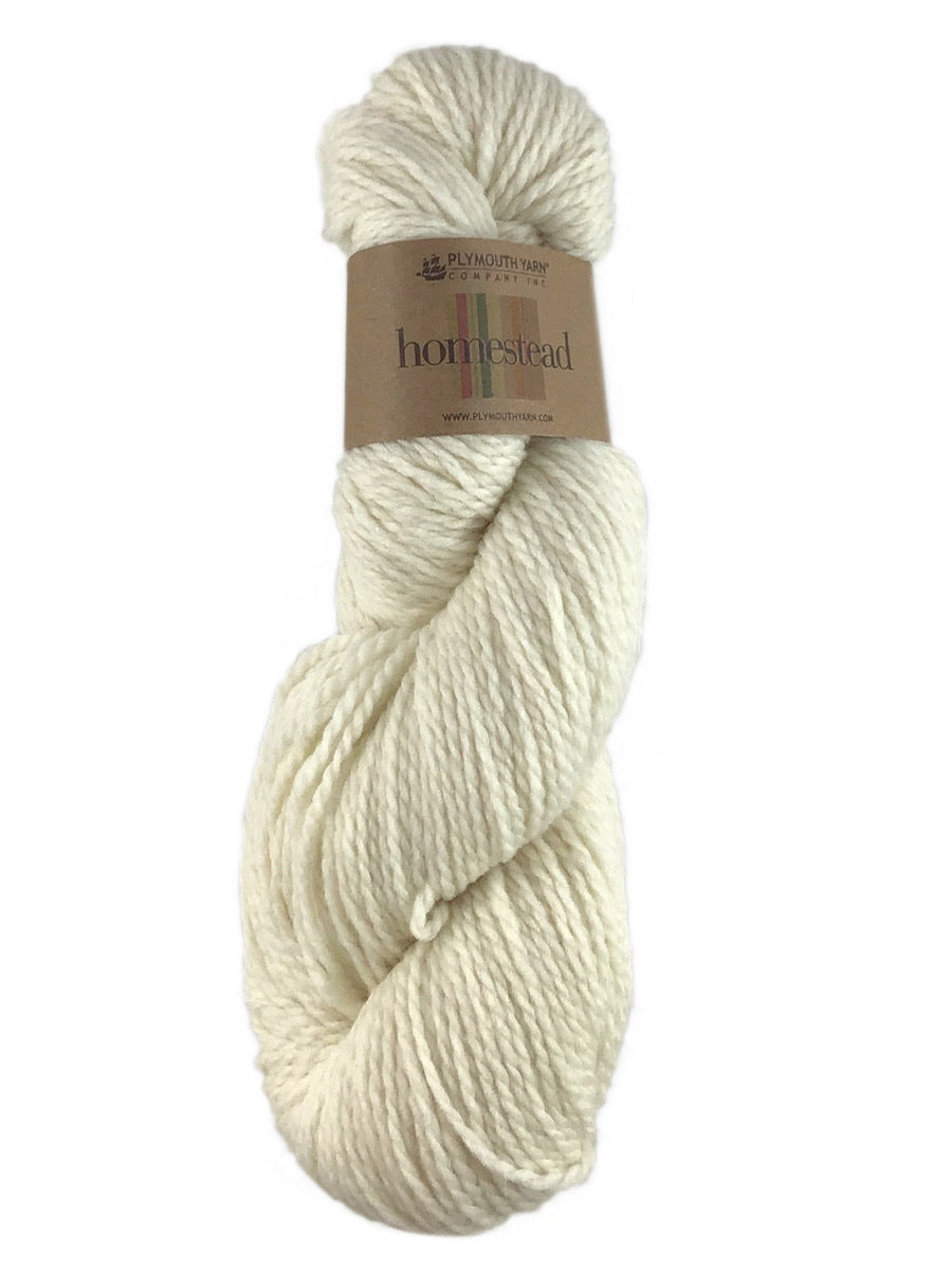 A white skein of Plymouth Homestead yarn