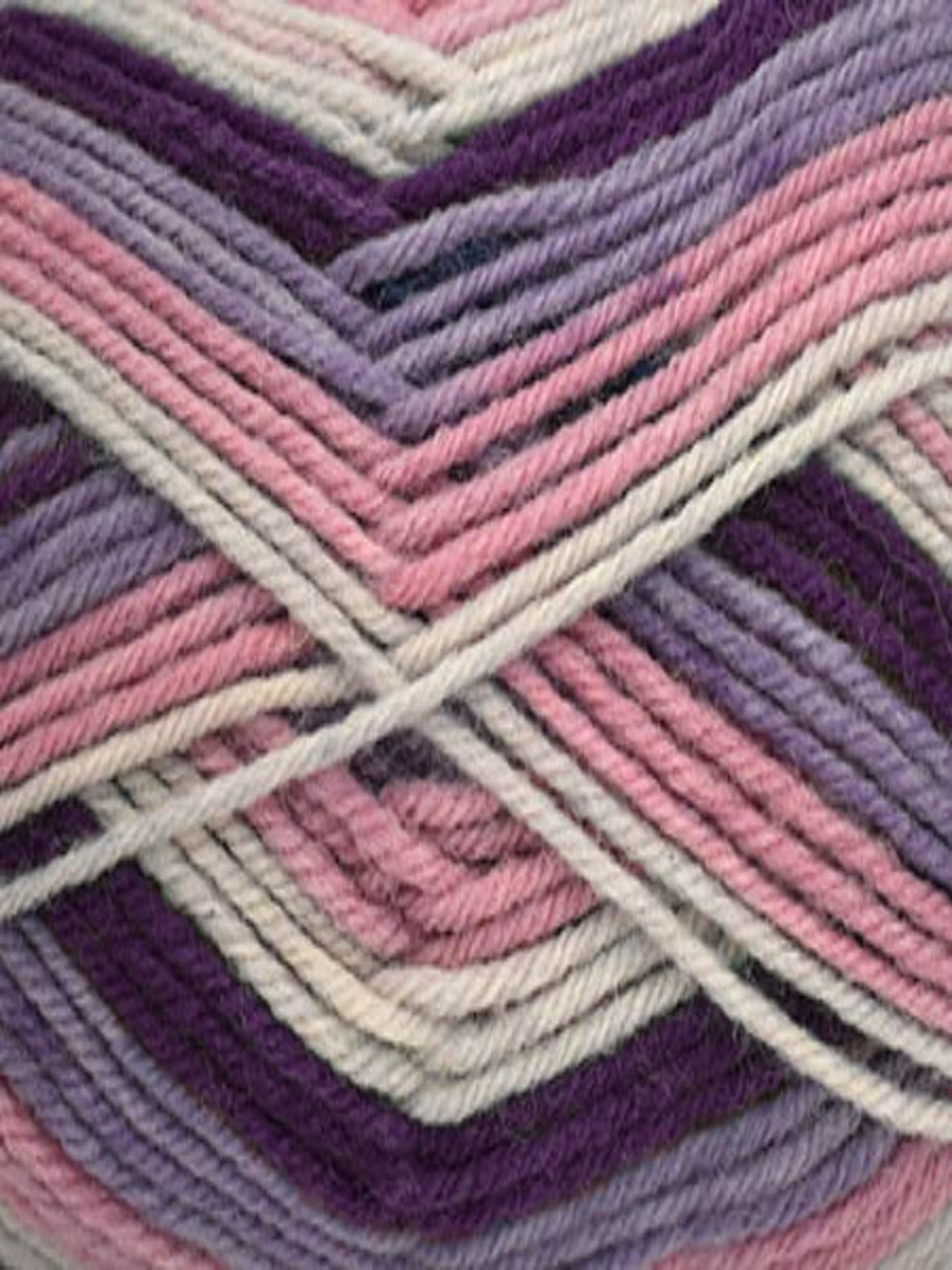 Close up of a skein of Deluxe Stripes in colorway 305 Fresh Figs