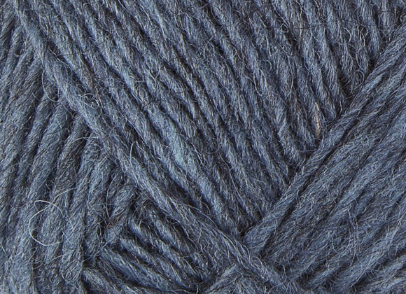 A close up photo of blue Istex Lettlopi yarn