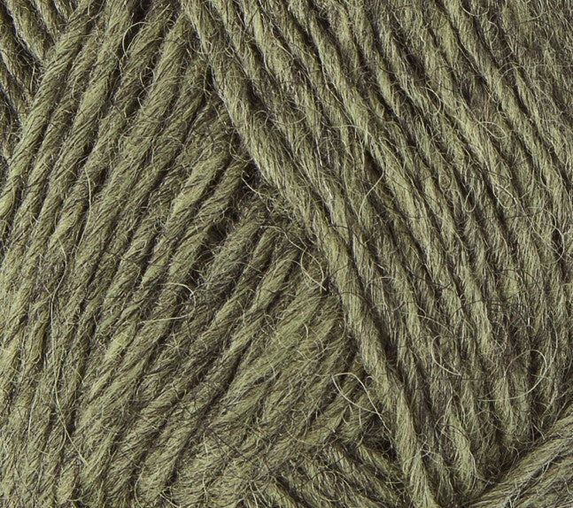 A close up photo of light tan-green Istex Lettlopi yarn