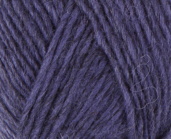 A close up photo of blue Istex Lettlopi yarn