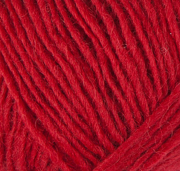 A close up photo of red Istex Lettlopi yarn