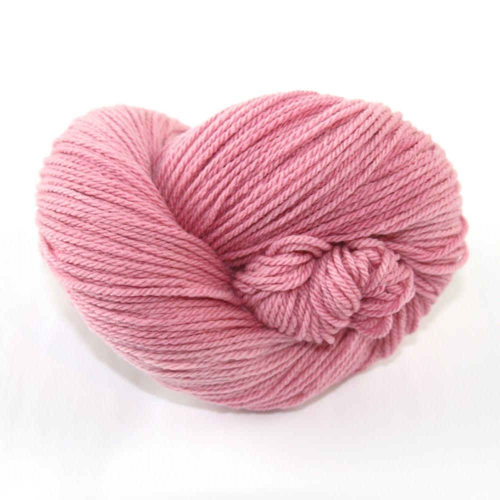A pink hank of the Mountain Meadow Wool Alpine collection.