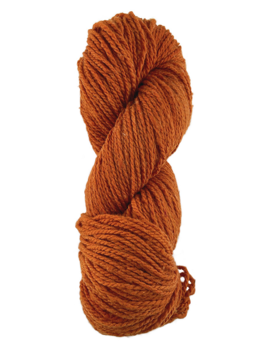 An orange skein of Mountain Meadow Wool Laramie yarn