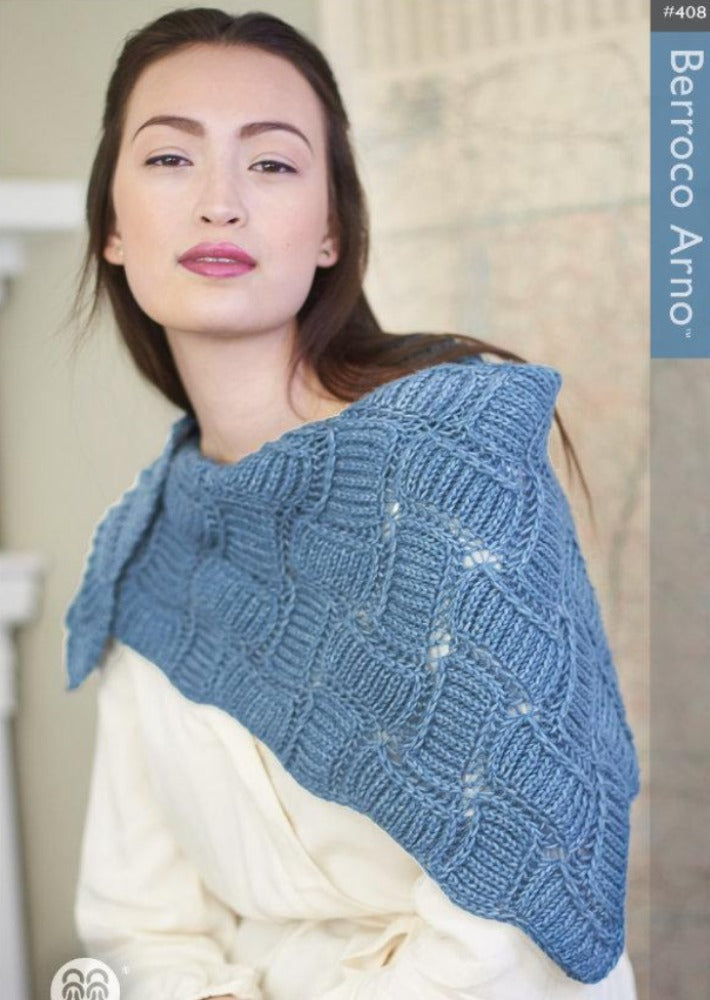 A woman wearing a blue knit shawl 