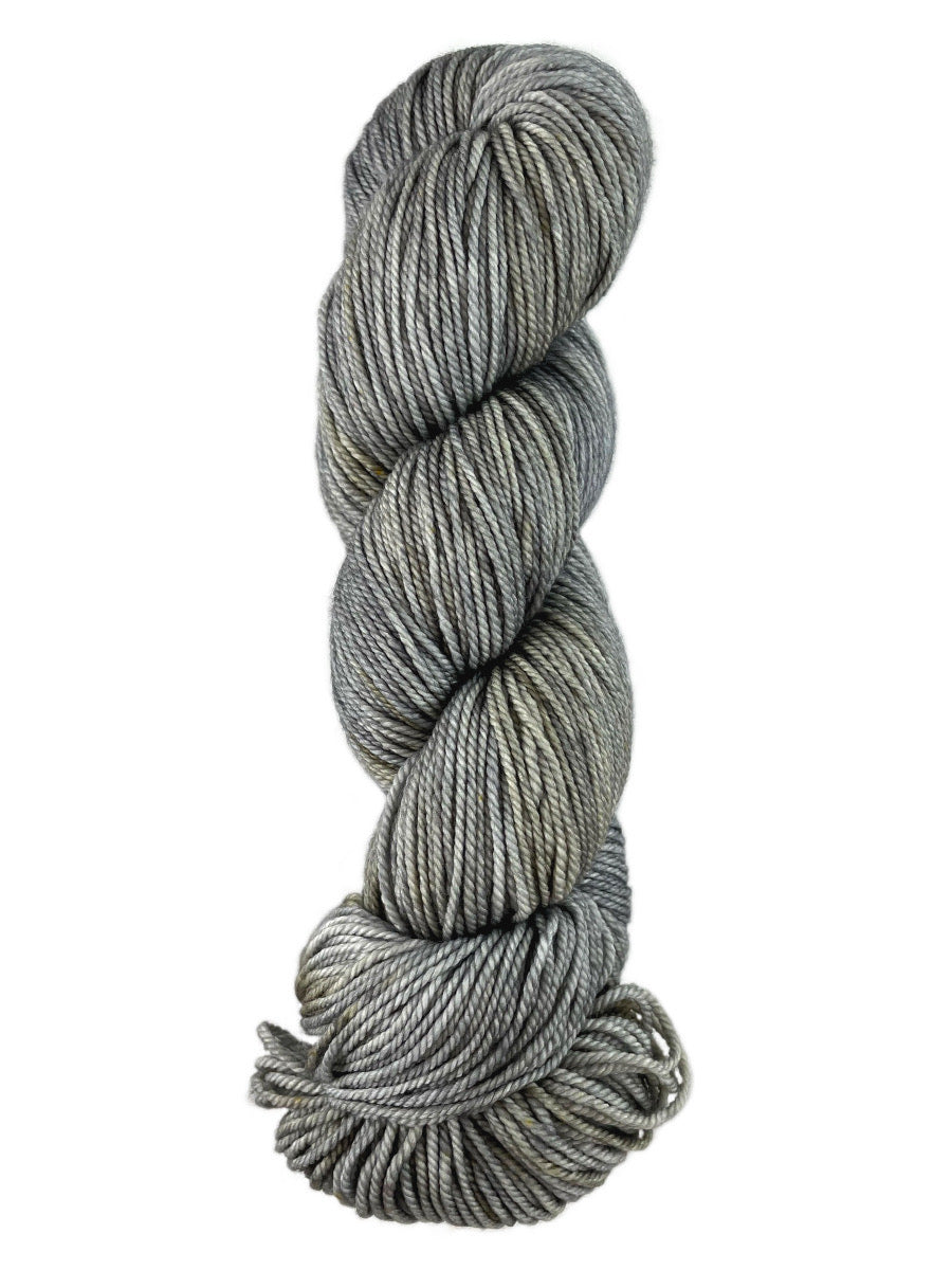 A grey skein of Western Sky Knits Merino 17 DK yarn
