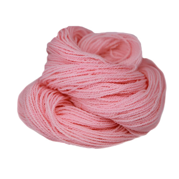 A light pink hank of the Mountain Meadow Wool Saratoga yarn collection