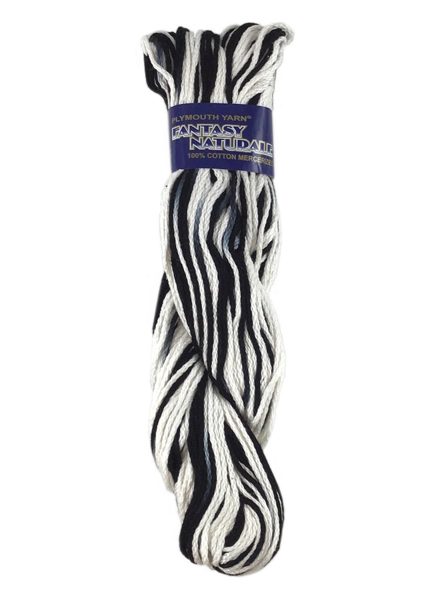 A black and white skein of Plymouth Fantasy Naturale yarn