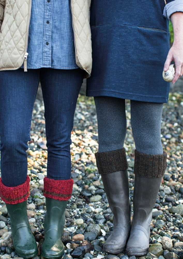 Two people wearing boots with boot cuff