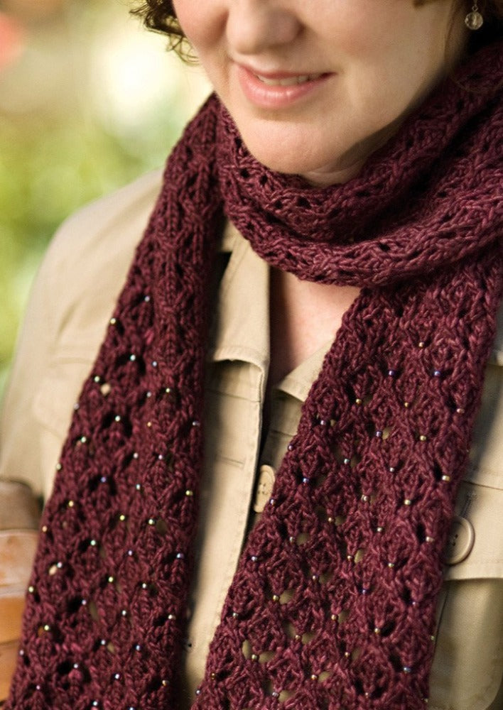 A woman wearing a knitted scarf
