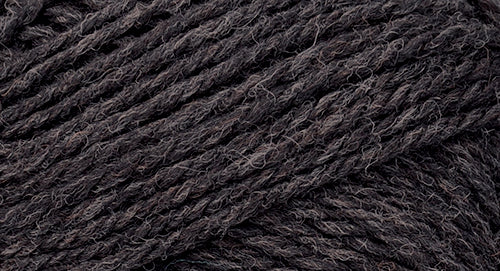 A close-up photo of a dark gray sample of Nature Spun yarn