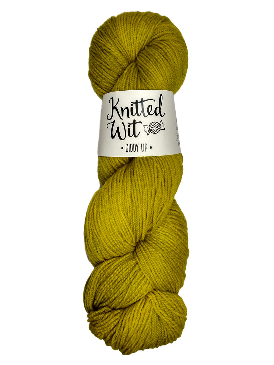 A colorful yellow-green hank of Knitted Wit's Giddy Up Yarn