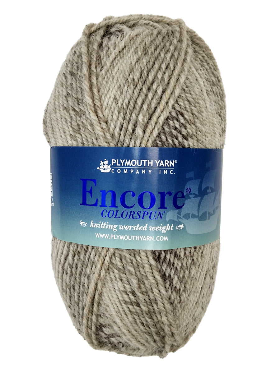 a grey mix skein of Plymouth Encore Colorspun yarn