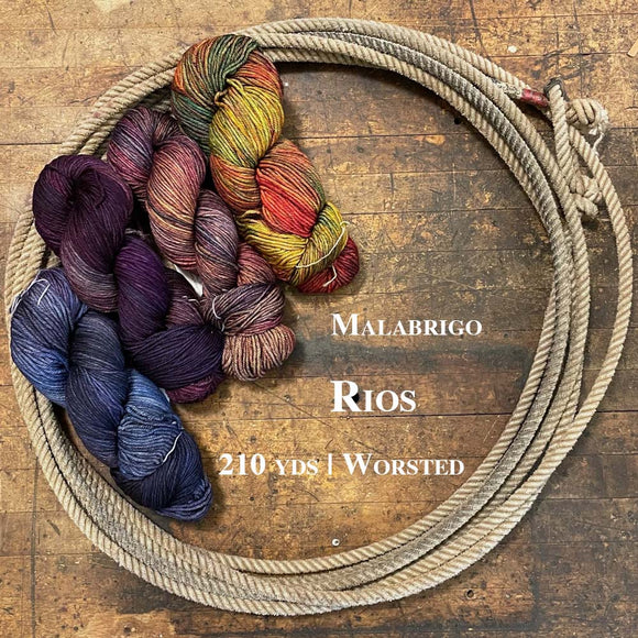 Skein of Malabrigo Rios wool yarn on a wooden surface