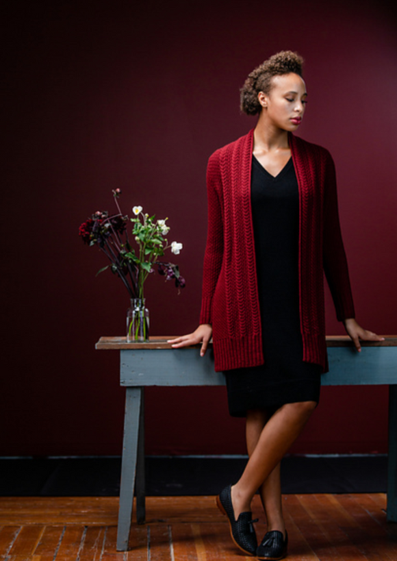 A woman wearing a knitting cardigan