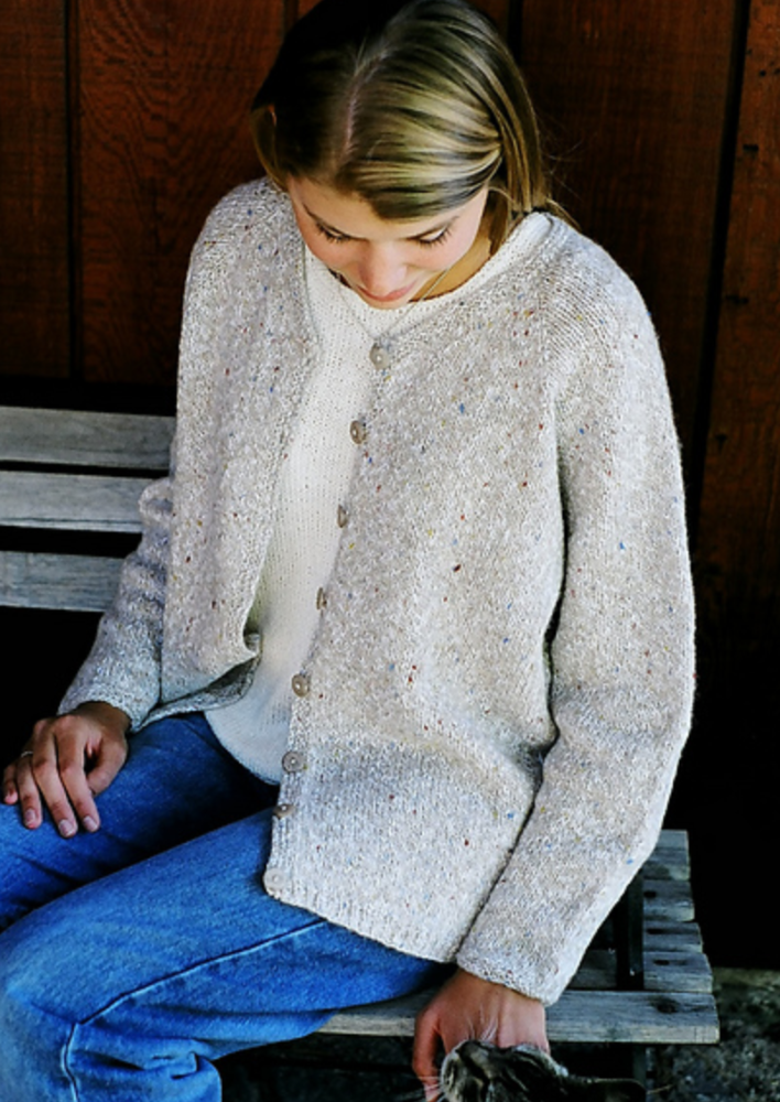 A woman wearing a knitted cardigan