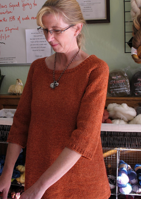 A woman wearing a knitted sweater