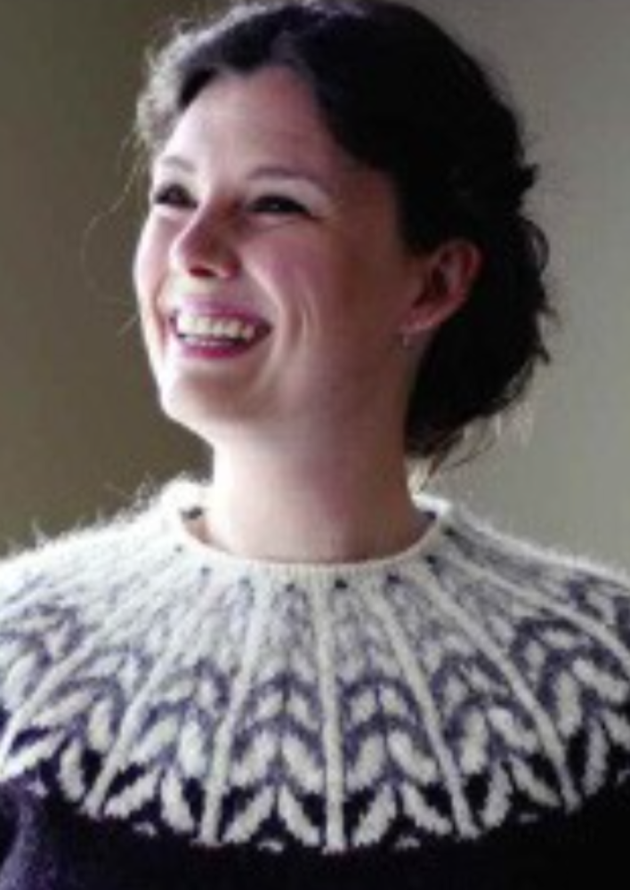 A woman wearing a colorwork sweater