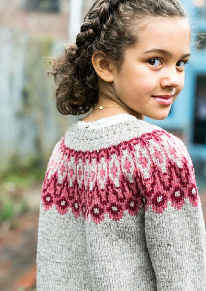 A girl wearing a knitted sweater