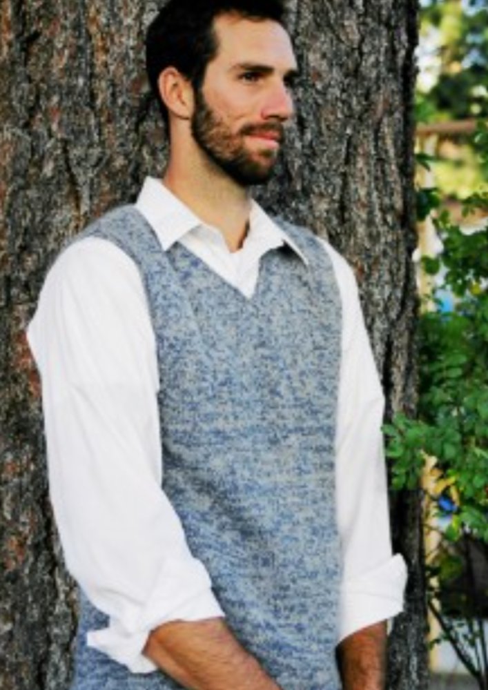 A man wearing a knitted sweater vest