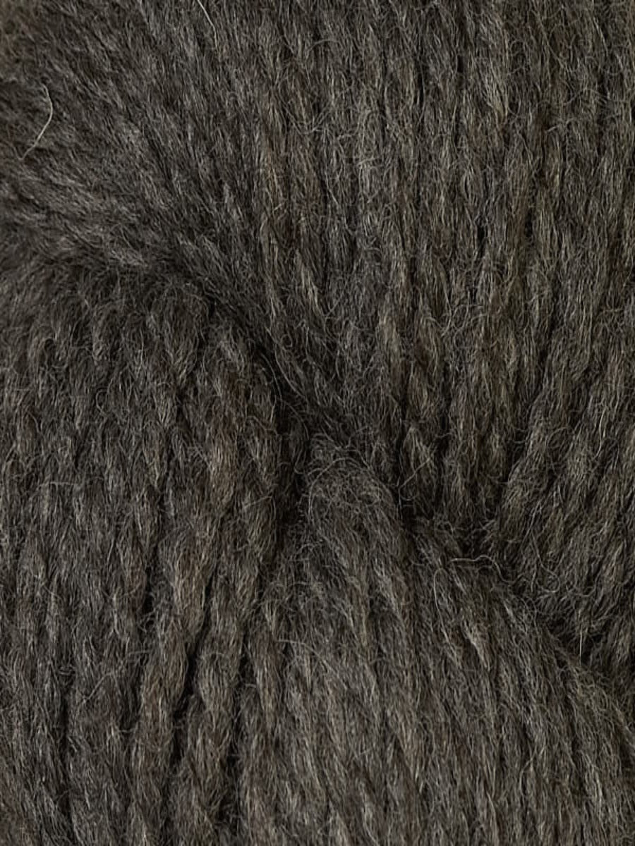 An up close shot of Berroco Ultra Alpaca Chunky Natural in colorway Farrow, a dark gray yarn.